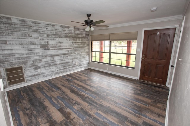 foyer with ornamental molding, baseboards, visible vents, a ceiling fan, and wood finished floors