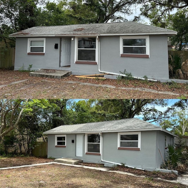 single story home with a shingled roof, fence, and stucco siding