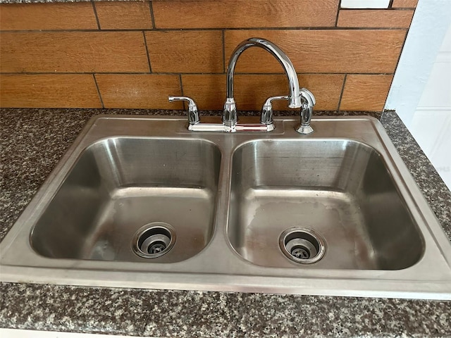 details featuring dark countertops and a sink