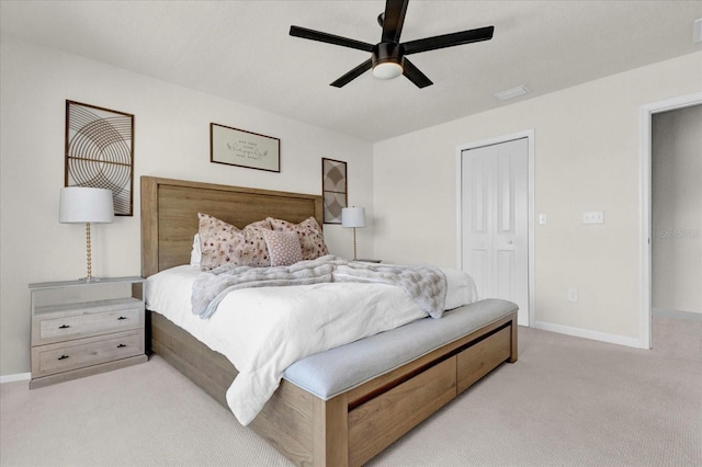 carpeted bedroom with a closet, visible vents, ceiling fan, and baseboards