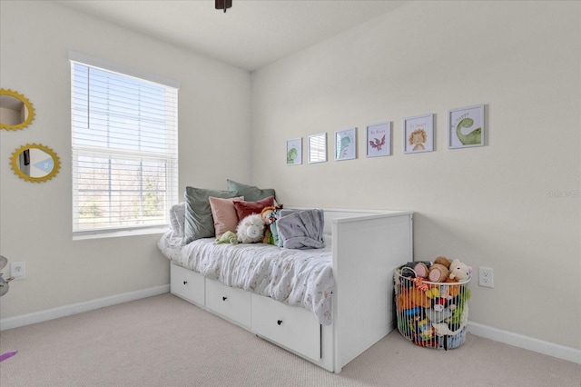 carpeted bedroom with baseboards