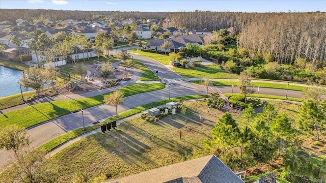 birds eye view of property with a residential view and a water view