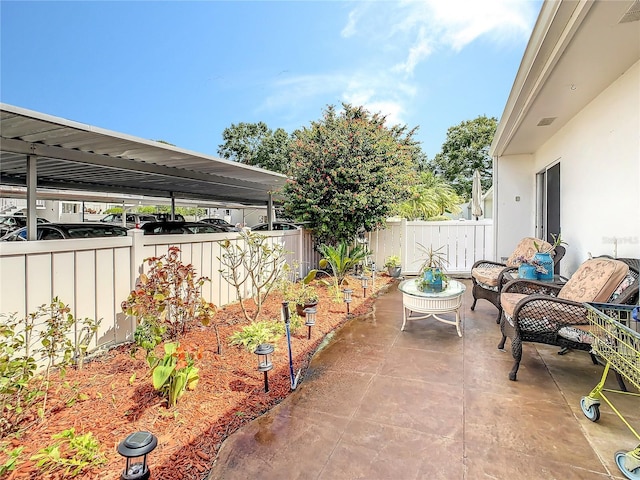 view of patio / terrace with a vegetable garden and a fenced backyard