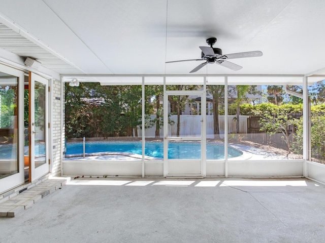 view of pool with a fenced in pool, a patio area, fence, and ceiling fan