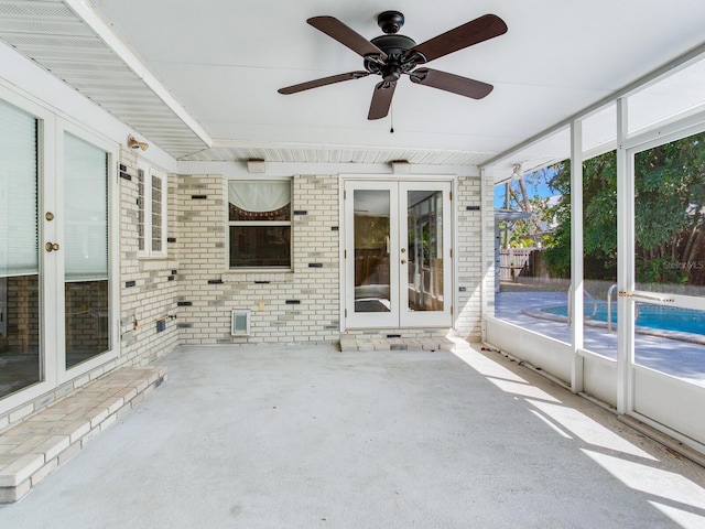 unfurnished sunroom with french doors