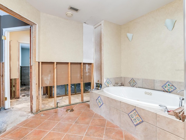 full bath with tile patterned floors, visible vents, and a bath