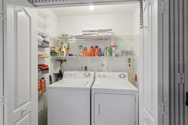 laundry room featuring washer and clothes dryer and laundry area