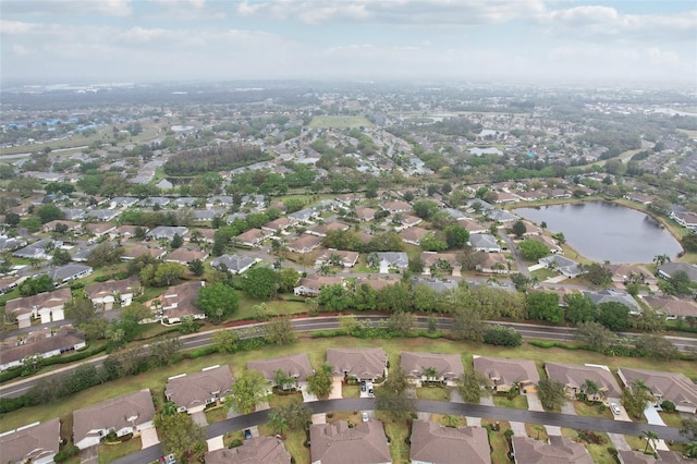 bird's eye view with a residential view and a water view