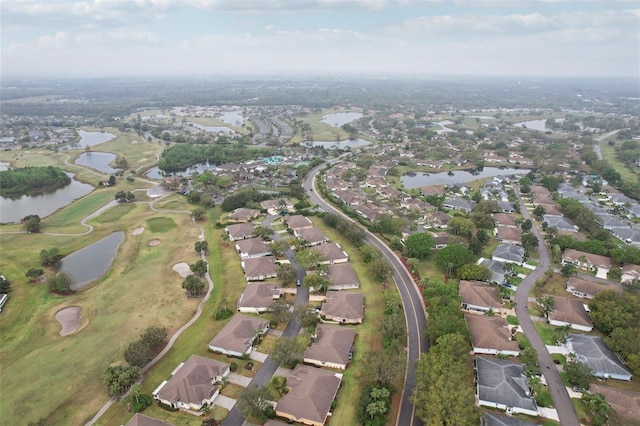 drone / aerial view featuring a residential view and a water view