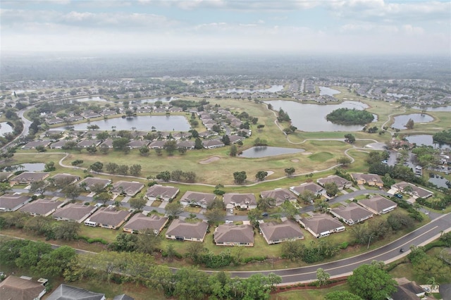 bird's eye view featuring a residential view and a water view