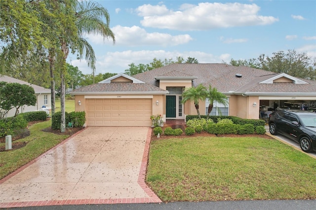 ranch-style home with a front lawn, concrete driveway, roof with shingles, stucco siding, and an attached garage