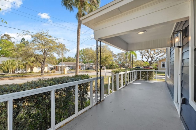 balcony featuring a residential view and covered porch