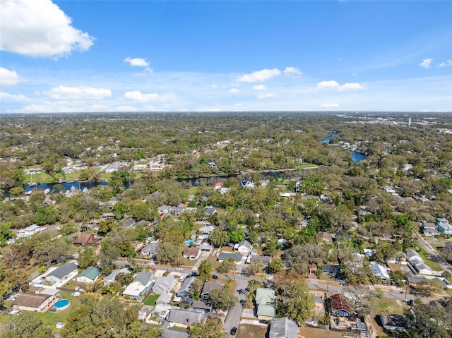 drone / aerial view with a water view and a residential view