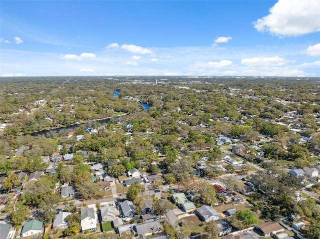 drone / aerial view featuring a residential view and a water view