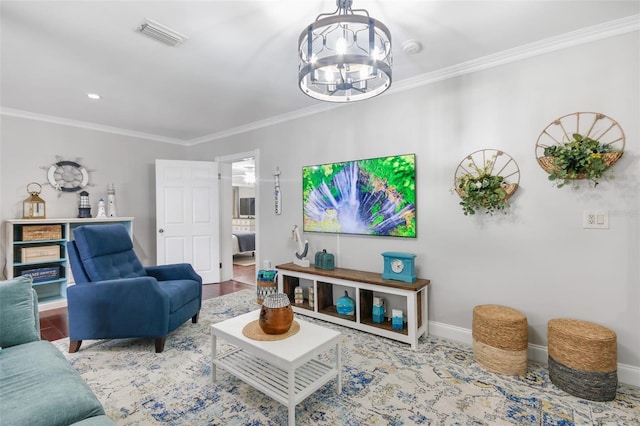 living room with a notable chandelier, wood finished floors, visible vents, baseboards, and ornamental molding