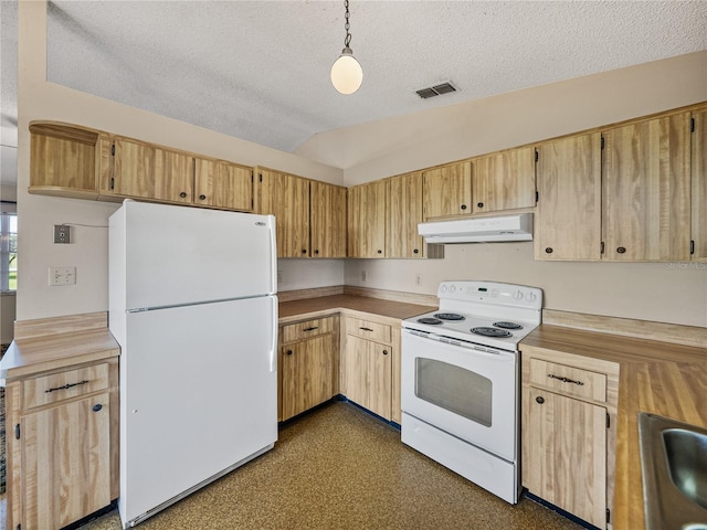 kitchen with white appliances, visible vents, vaulted ceiling, a textured ceiling, and under cabinet range hood