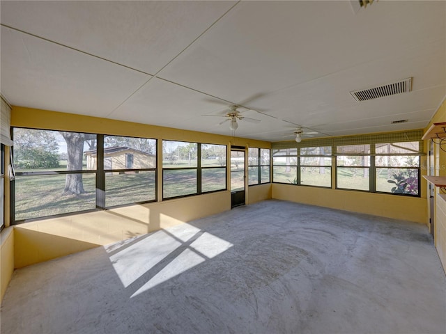 unfurnished sunroom with visible vents