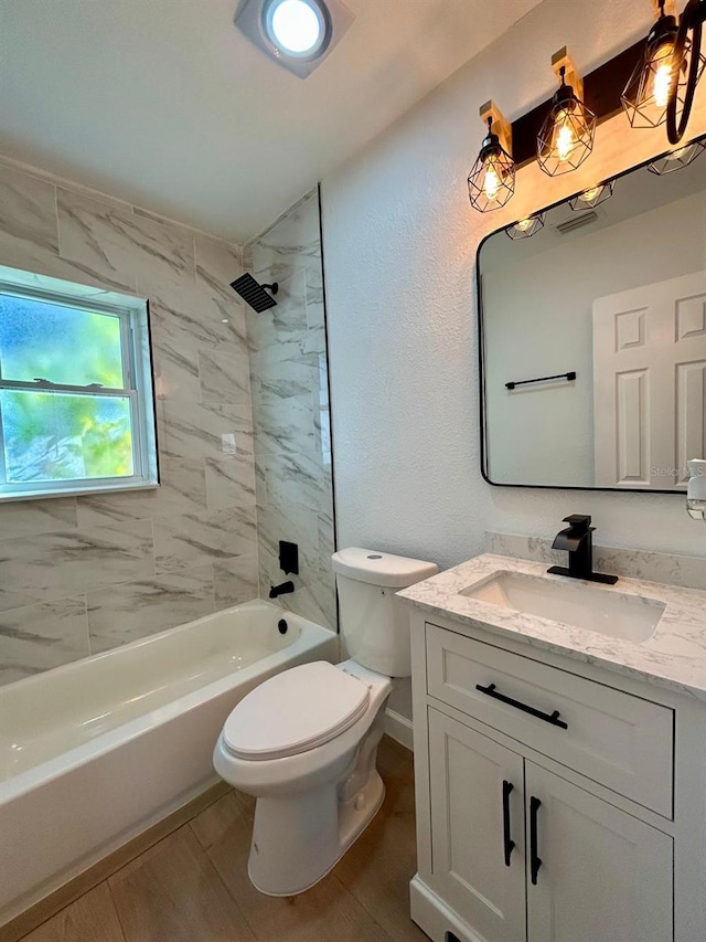 full bath featuring shower / tub combination, vanity, toilet, and wood finished floors