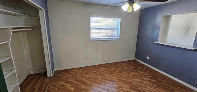 unfurnished bedroom with ceiling fan, a closet, wood finished floors, and baseboards