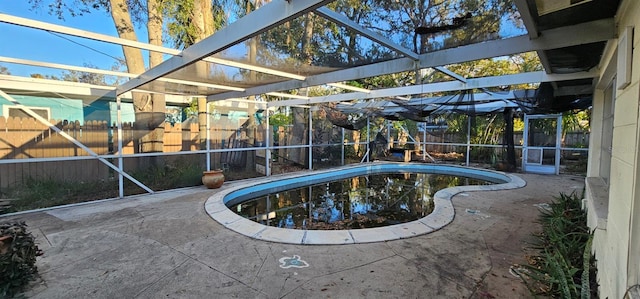 view of pool with a patio, a fenced backyard, a lanai, and a fenced in pool