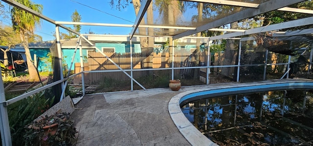 view of pool featuring a fenced in pool, a lanai, a patio area, and fence