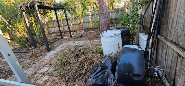 view of yard with central air condition unit and fence private yard