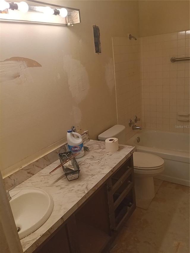 full bathroom featuring bathtub / shower combination, vanity, and toilet