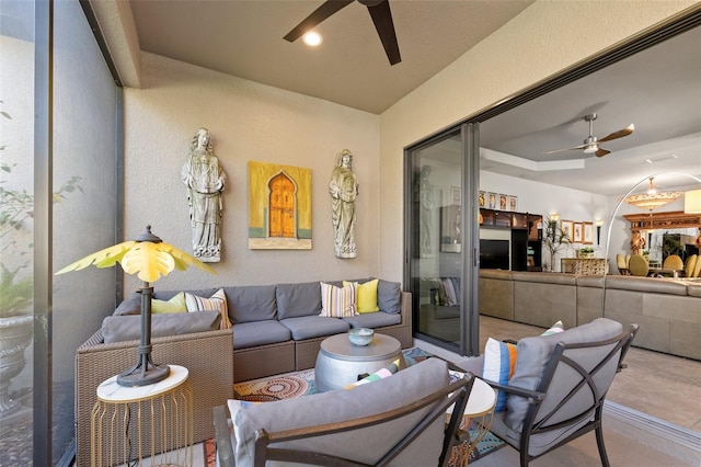 living room with recessed lighting, a ceiling fan, and a textured wall