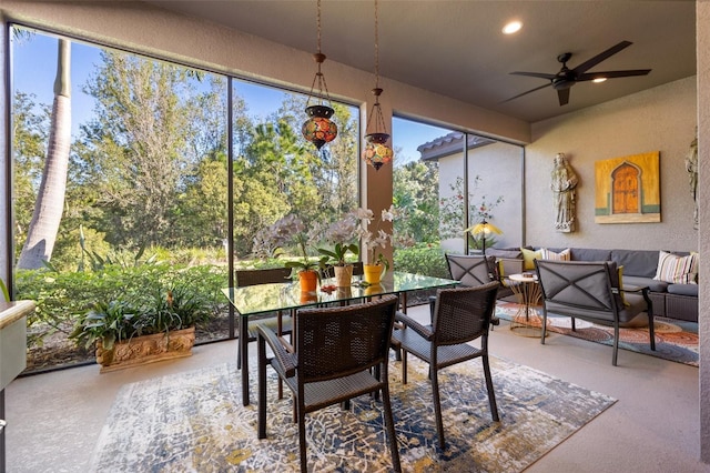 sunroom featuring ceiling fan