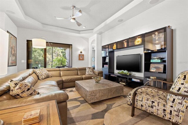 9708 Highland Park Pl, Palmetto, FL 34221 - living room with ceiling fan and a tray ceiling