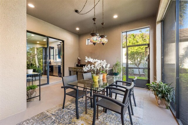 9708 Highland Park Pl, Palmetto, FL 34221 - dining room featuring a textured wall, recessed lighting, a chandelier, and a textured ceiling