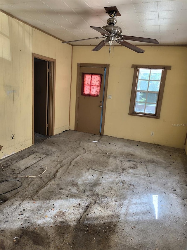 unfurnished room featuring a ceiling fan