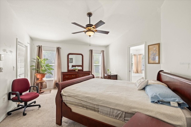 bedroom with carpet, multiple windows, lofted ceiling, and baseboards