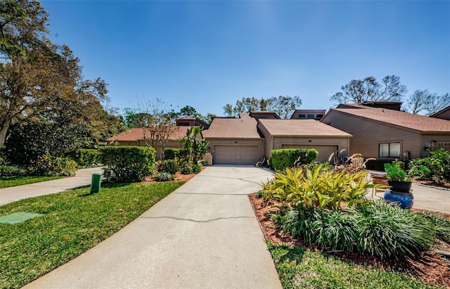 view of front of property featuring a garage and driveway