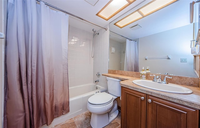 full bath featuring shower / bath combo, vanity, and toilet