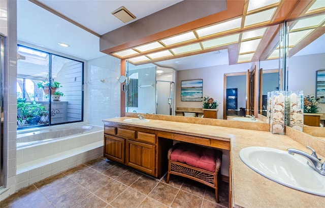 bathroom with double vanity, a sink, a bath, and a shower stall