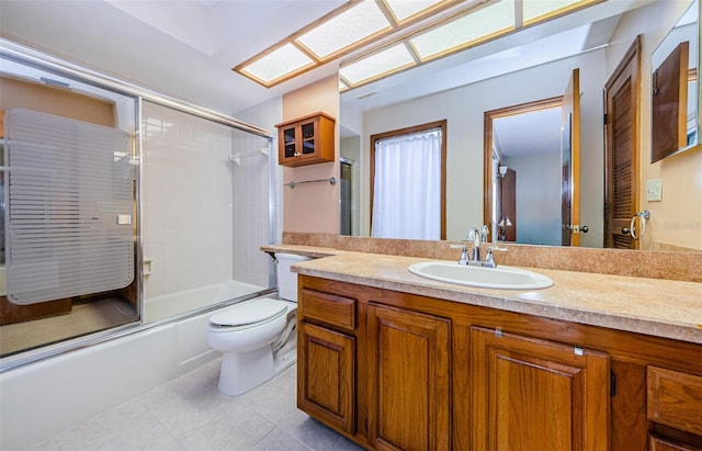 full bathroom with toilet, tile patterned floors, enclosed tub / shower combo, and vanity