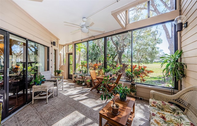 sunroom / solarium featuring ceiling fan