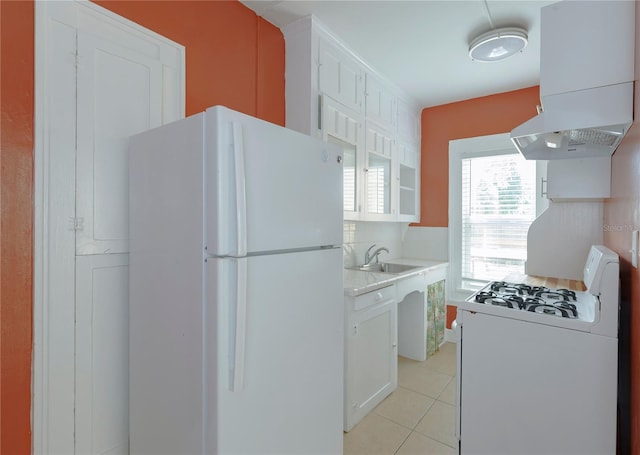 kitchen with light tile patterned floors, light countertops, a sink, white appliances, and extractor fan