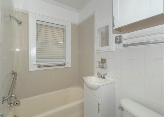 bathroom with a tub to relax in, toilet, vanity, tile walls, and a shower