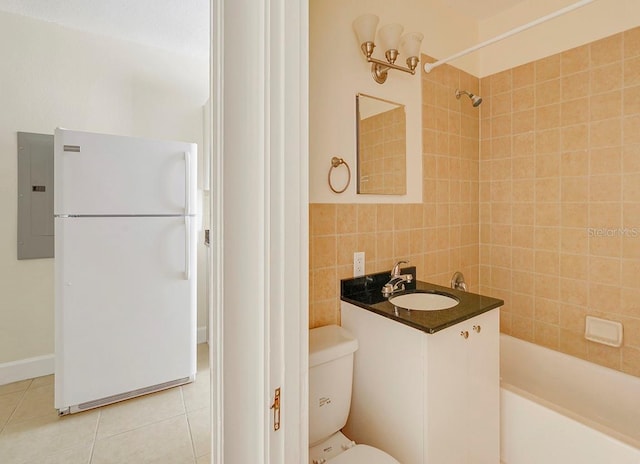 full bathroom with tile patterned flooring, toilet, shower / bath combination, tile walls, and electric panel
