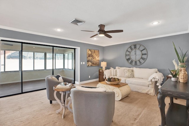 living area with carpet floors, recessed lighting, visible vents, ornamental molding, and baseboards