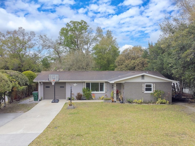 ranch-style house featuring brick siding, an attached garage, concrete driveway, and a front yard