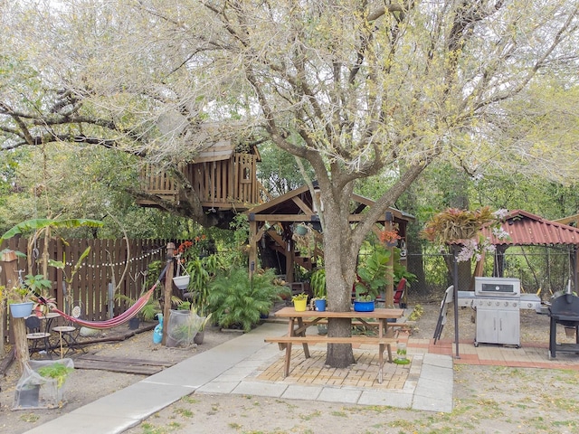 view of patio / terrace featuring a gazebo and fence