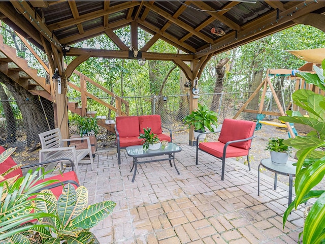 view of patio with a gazebo, a fenced backyard, and an outdoor living space