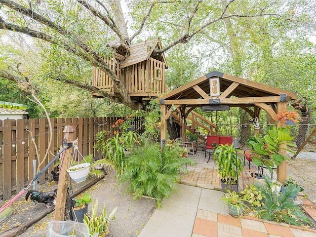 view of patio featuring a gazebo and a fenced backyard