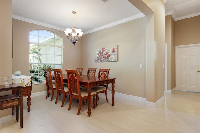 dining area with crown molding, baseboards, and an inviting chandelier