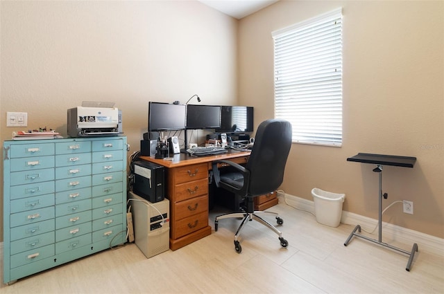 office space with baseboards