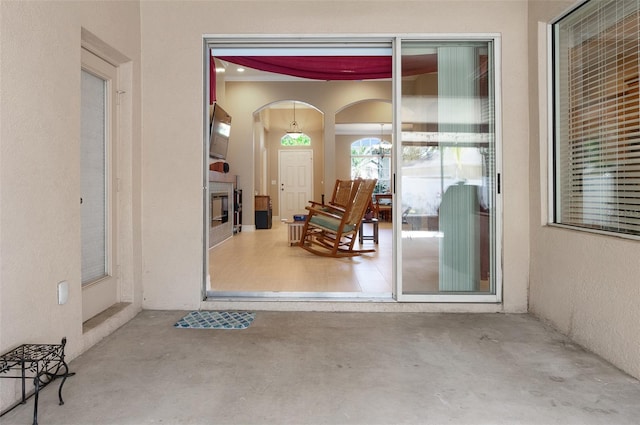 doorway to property with stucco siding