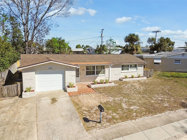 ranch-style house featuring a garage, concrete driveway, roof with shingles, and fence